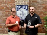 PIO Ethan Smith and Project Designer Michael Berley with award