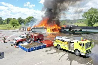 Firefighters training in a live burn scenario