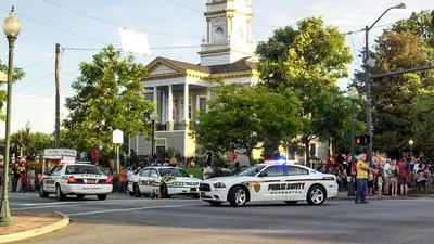 Public Safety cars parked on Sterling Street near Courthouse Square