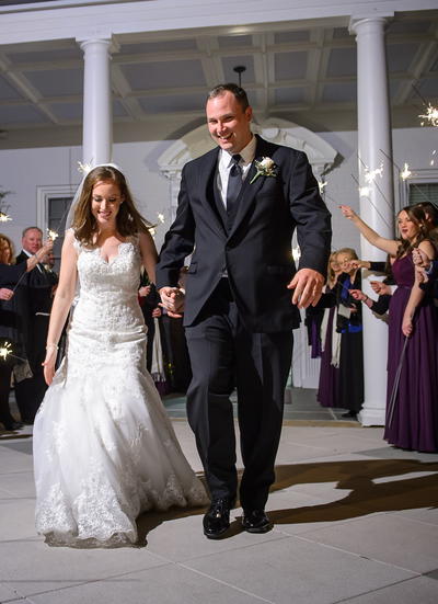 Bride and groom leaving venue