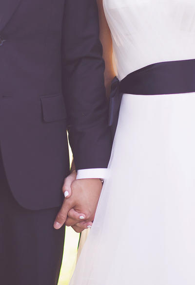 Bride and groom holding hands
