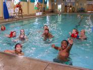 Group of kids swimming in pool