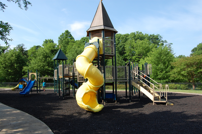 Other angle of yellow tube slide and play structure