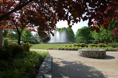 Path with grass and splash pad in background